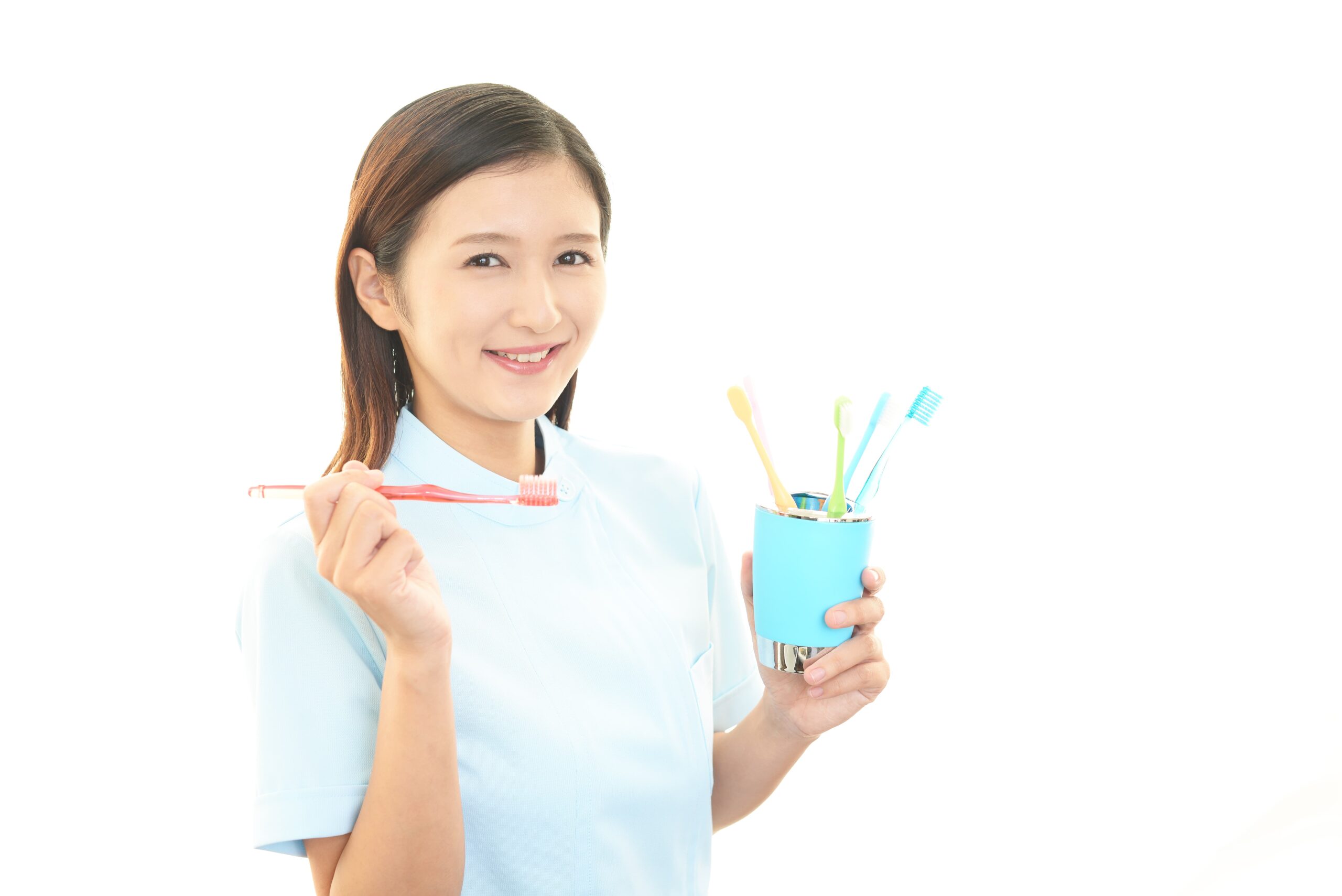 歯ブラシを持っている歯科衛生士